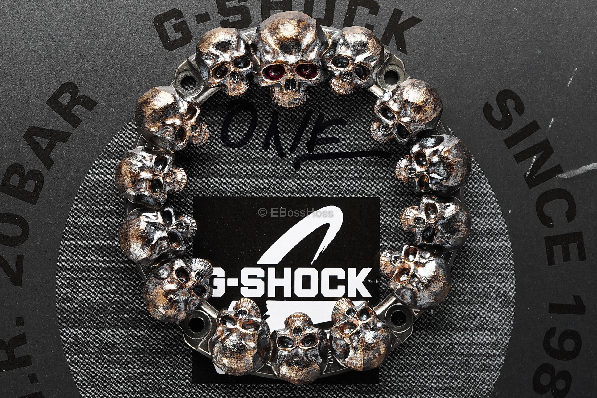 Steel Flame Custom Sledge G-Shock- ONE - with Pile of Darkness Skulls in Bronze-- by Derrick Obatake